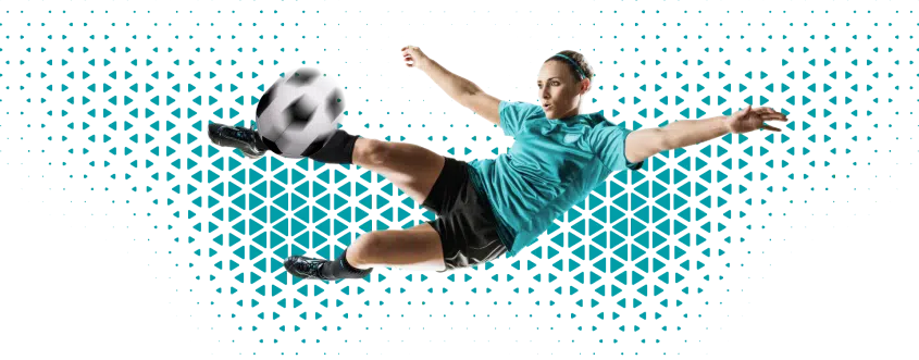 a woman kicking a football ball